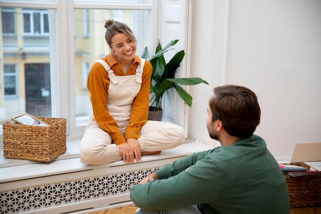 Free photo young couple moving in new home