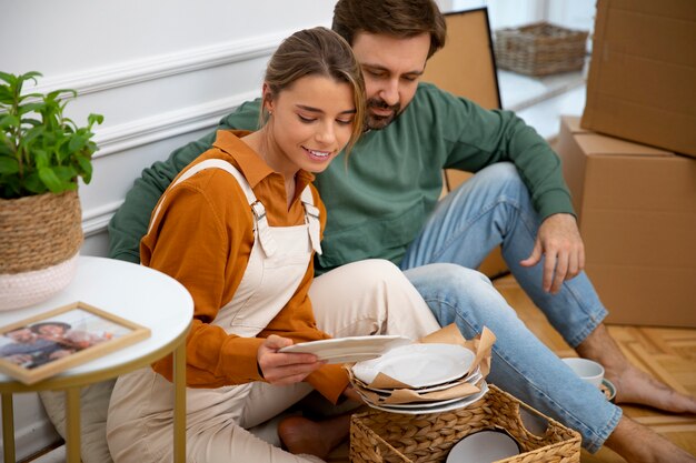 Free photo young couple moving in new home