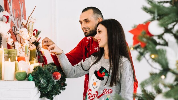 Young couple near candles 