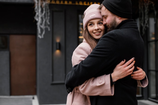 Free photo young couple outdoor hugging