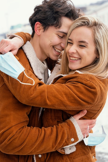 Young couple outdoor hugging