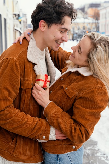 Young couple outdoor hugging