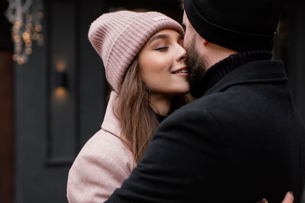 young couple outdoor kissing