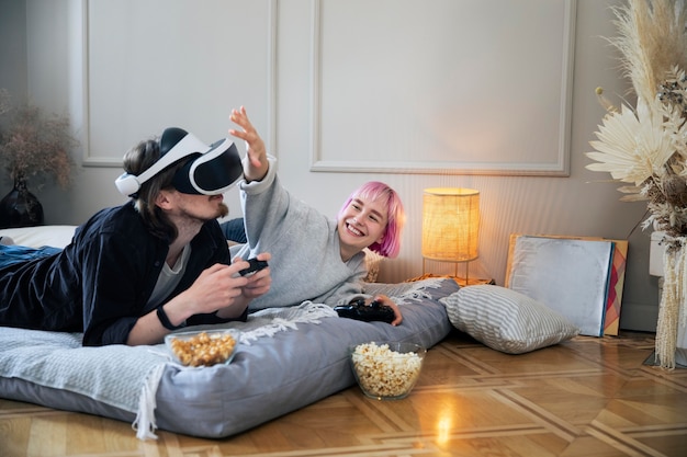 Free photo young couple playing a vr game