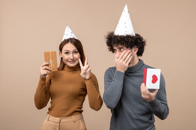 A young couple posing in the studio