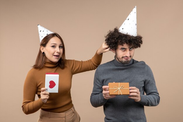 A young couple posing in the studio