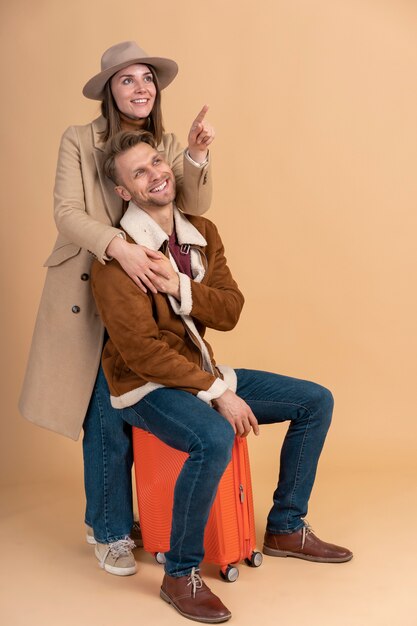 Young couple posing together before traveling