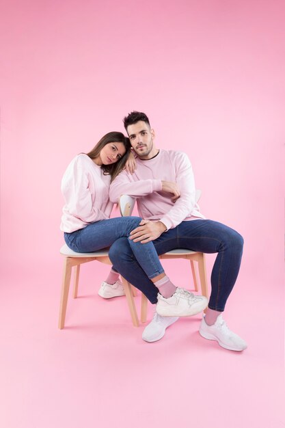 Young couple resting on chairs
