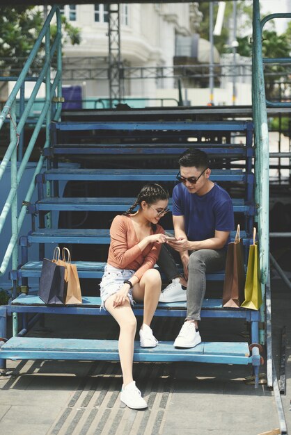 Young couple resting on steps