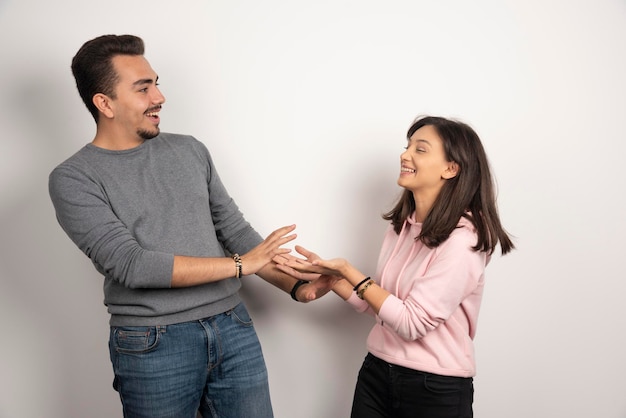 Young couple sharing their stories on white.