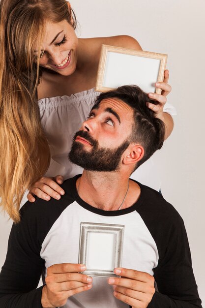 Young couple showing frames