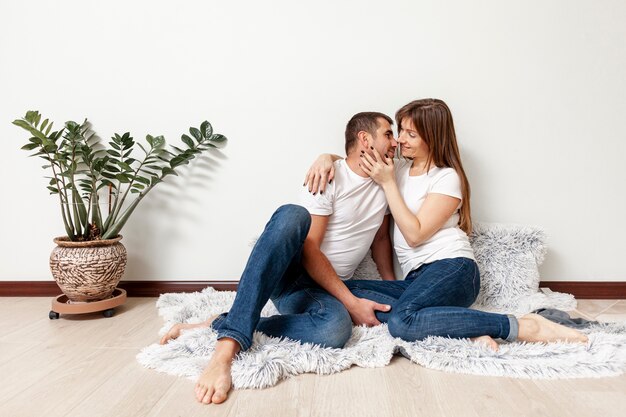 Young couple sitting on blanket