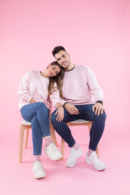 Young couple sitting on chairs