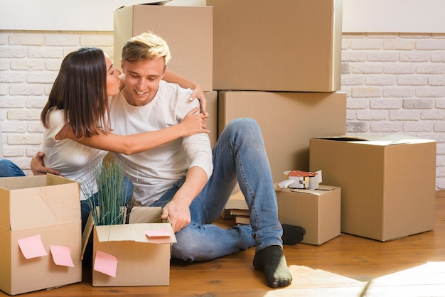 Young couple sitting on the floor