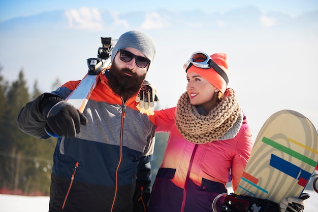 Young couple on the ski trip