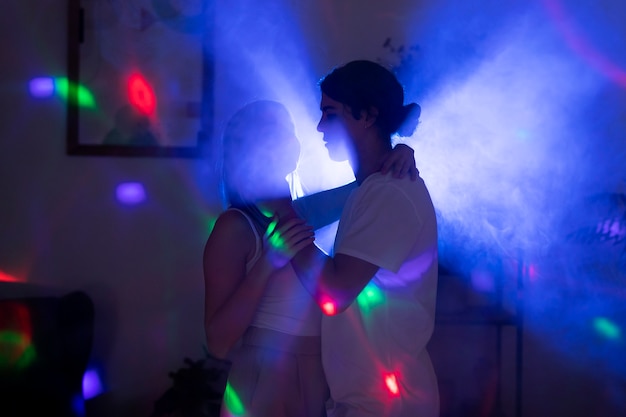 Free photo young couple spending time together at night