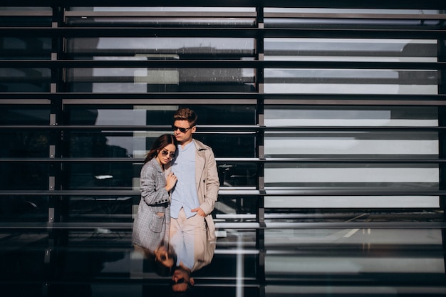 Young couple standing by the building