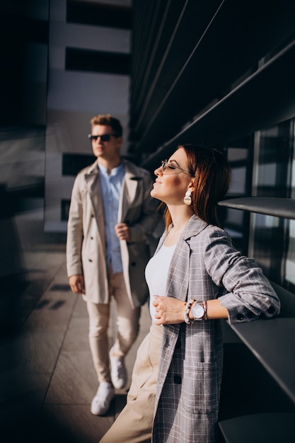 Young couple standing by the building