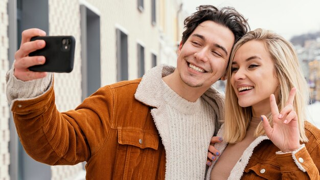 Young couple taking photos