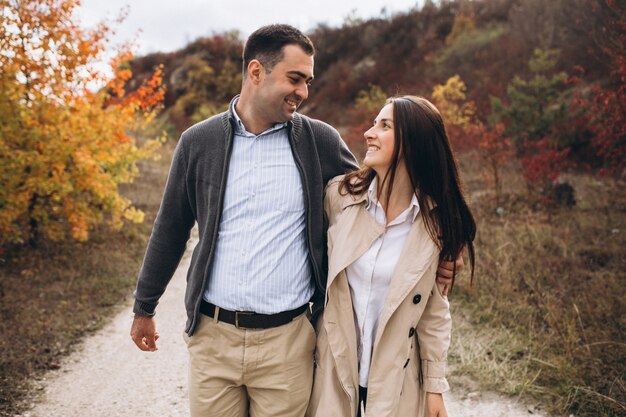 Young couple together in an autumn nature