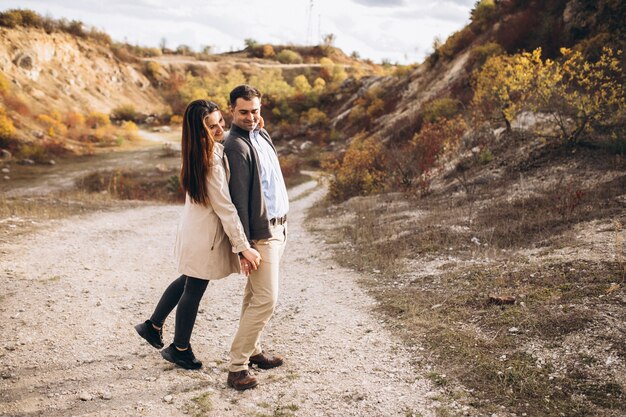 Young couple together in an autumn nature