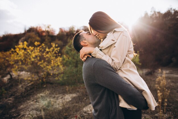 Young couple together in an autumn nature