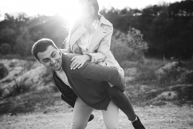 Young couple together in an autumn nature