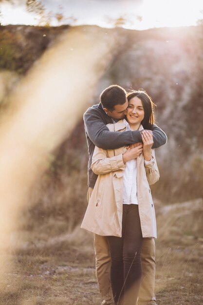 Young couple together in an autumn nature