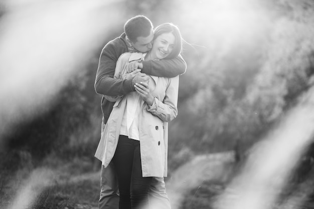 Young couple together in an autumn nature