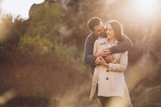 Young couple together in an autumn nature