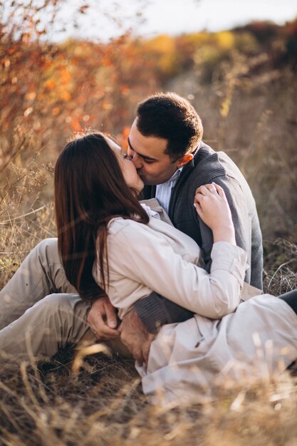 Young couple together in an autumn nature