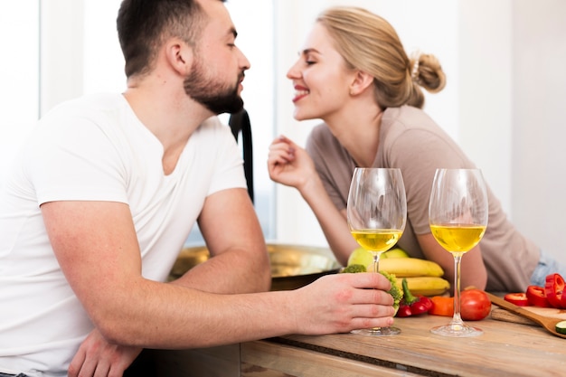 Free photo young couple together at the kitchen