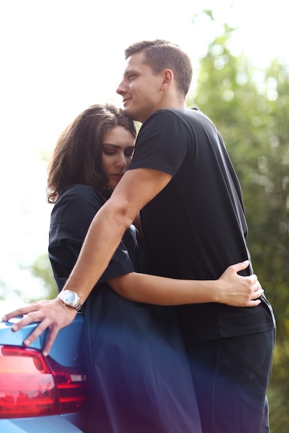 Free photo young couple traveling by car