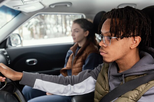 young couple traveling by car