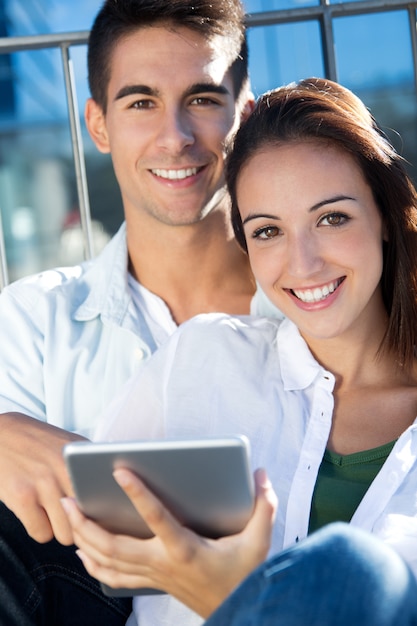 young couple using a digital tablet