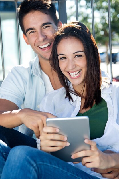 young couple using a digital tablet