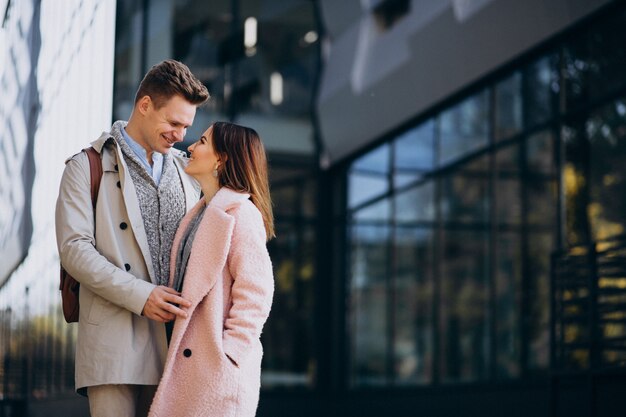 Young couple walking together in town