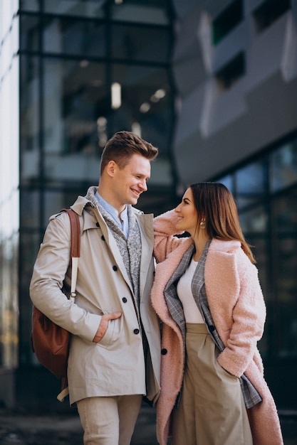 Young couple walking together in town