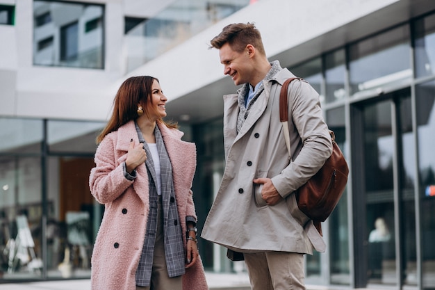 Young couple walking together in town