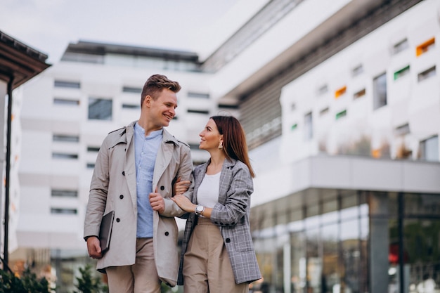 Young couple walking together in town