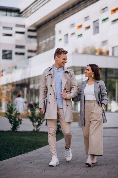 Young couple walking together in town
