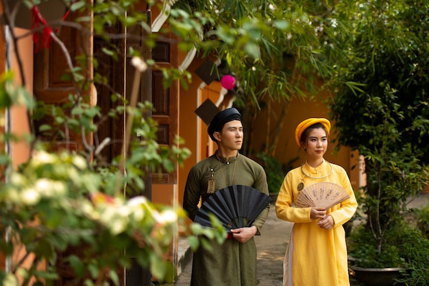 Young couple wearing ao dai costume