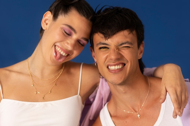 Free photo young couple wearing chain necklace
