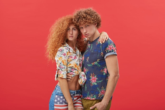 young couple wearing stylish clothes with floral design