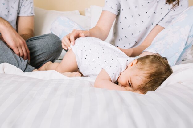 Young couple with baby in the morning