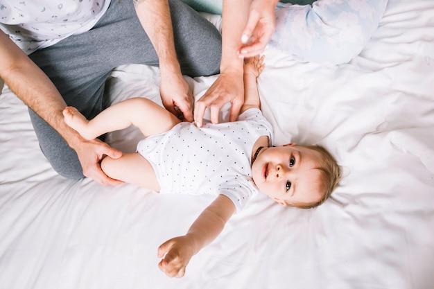 Free photo young couple with baby in the morning