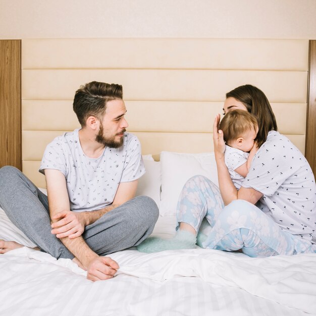 Young couple with baby in the morning