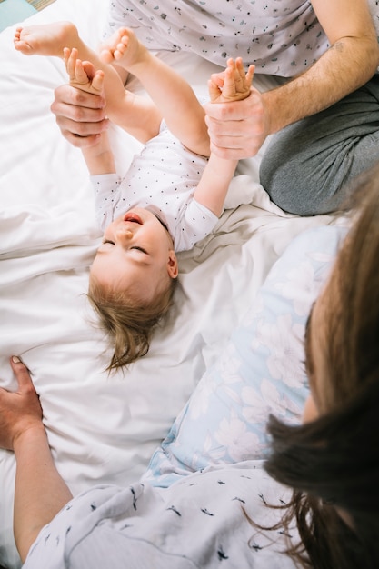 Free photo young couple with baby in the morning