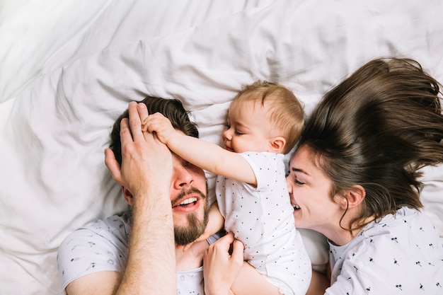 Young couple with baby in the morning