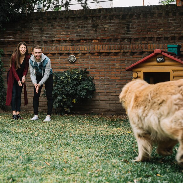 Young couple with cute dog